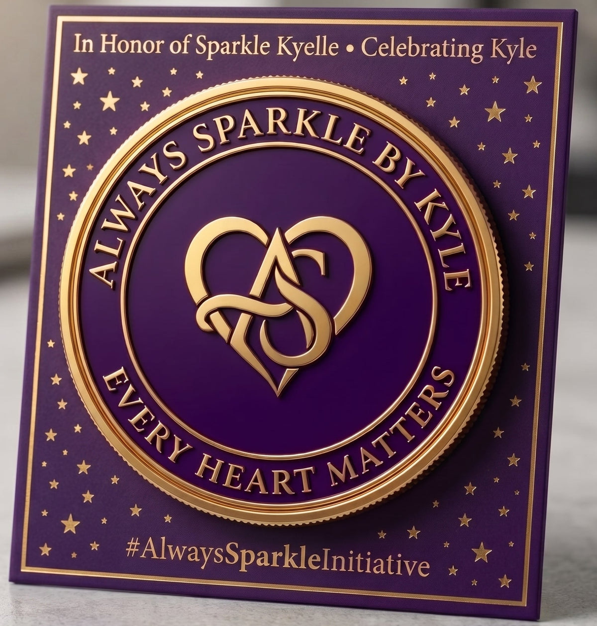 A square purple memorial-style plaque or card with gold border, gold stars, and a large central gold circular emblem reading “Always Sparkle by Kyle” and “Every Heart Matters,” plus personalized text at the top and bottom, photographed on a light neutral surface.